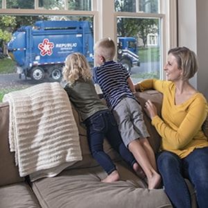 Family Watching Republic Garbage Truck